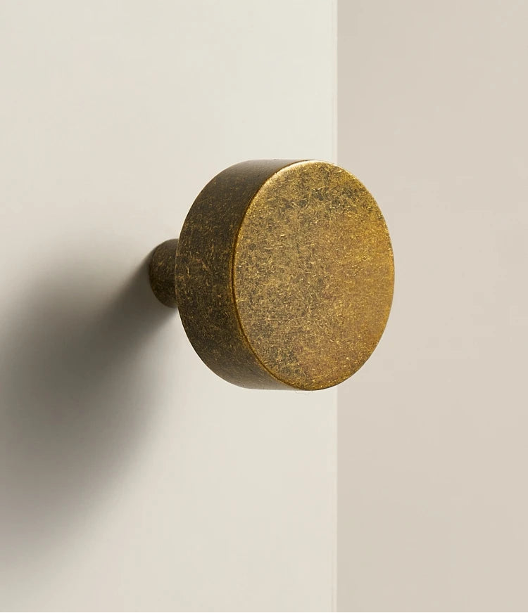 Aged ochre stone-effect furniture knob