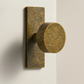 Aged ochre stone-effect furniture knob