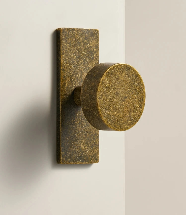Aged ochre stone-effect furniture knob