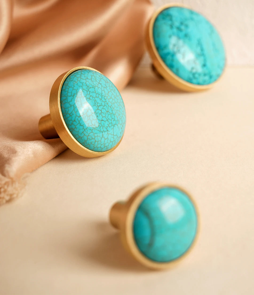 Brass furniture knob set with a natural turquoise stone
