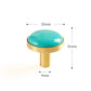 Brass furniture knob set with a natural turquoise stone