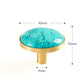 Brass furniture knob set with a natural turquoise stone