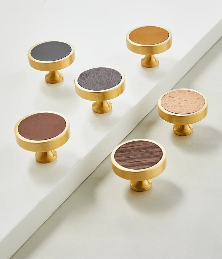 Brushed gold furniture knob with insert