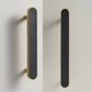Brass and black furniture handle