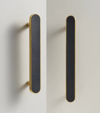 Brass and black furniture handle