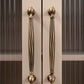 Twisted brass furniture handle, bronze effect