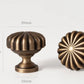 Poignée de meuble torsadée en laiton, effet bronze